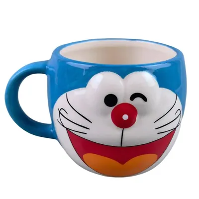 Mug Doraemon con cara sonriente en relieve azul y blanco