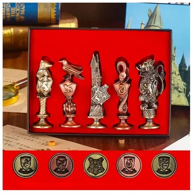 Set de cinco sellos Harry Potter con escudos de casas de Hogwarts en estuche rojo