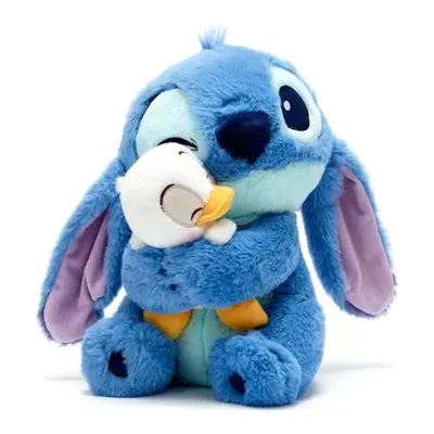 Peluche Stitch abraza pequeño pato blanco Lilo & Stitch