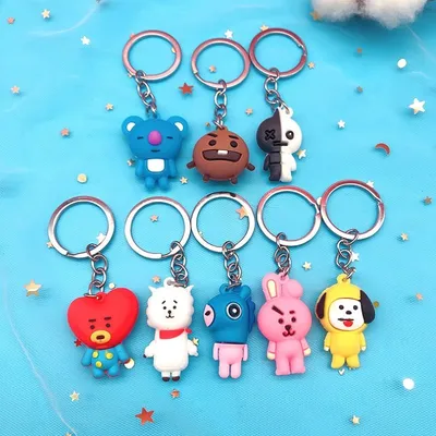 Ocho llaveros de goma BT21 con personajes de colores variados en anillos metálicos