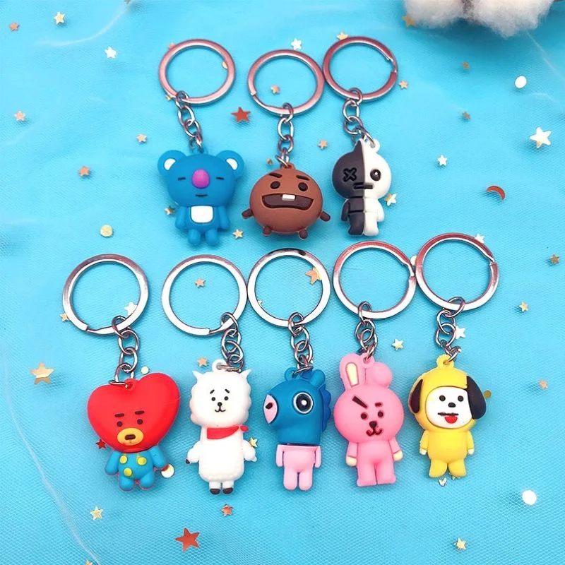Ocho llaveros de goma BT21 con personajes de colores variados en anillos metálicos