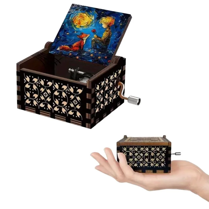 Caja musical El Principito con diseño de madera negra y tapa de noche estrellada