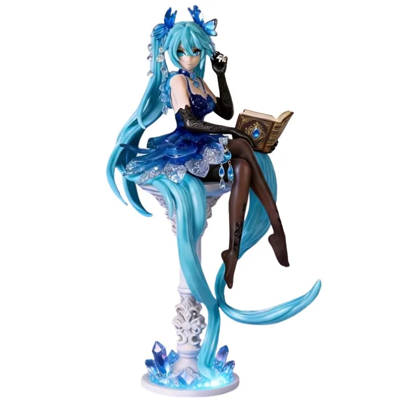 Figura Hatsune Miku sentada con libro, cabello turquesa y base de cristales azules