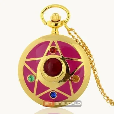 Reloj de bolsillo dorado Sailor Moon con broche de transformación magenta